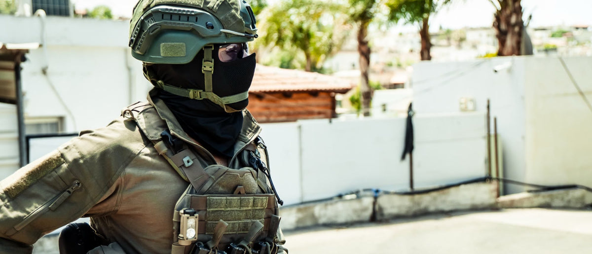 Operator in a plate carrier and helmet outdoors