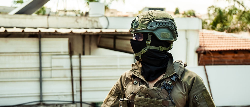Tactical operator in helmet and plate carrier