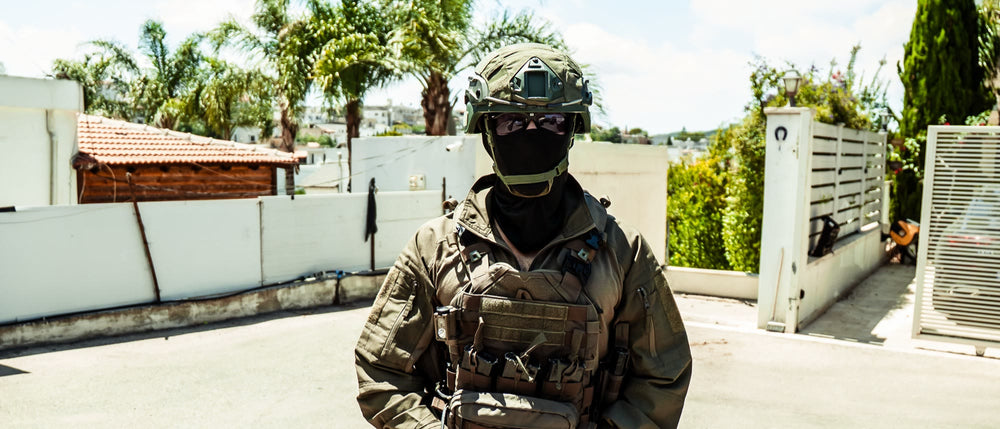 Operator standing in full kit with a plate carrier